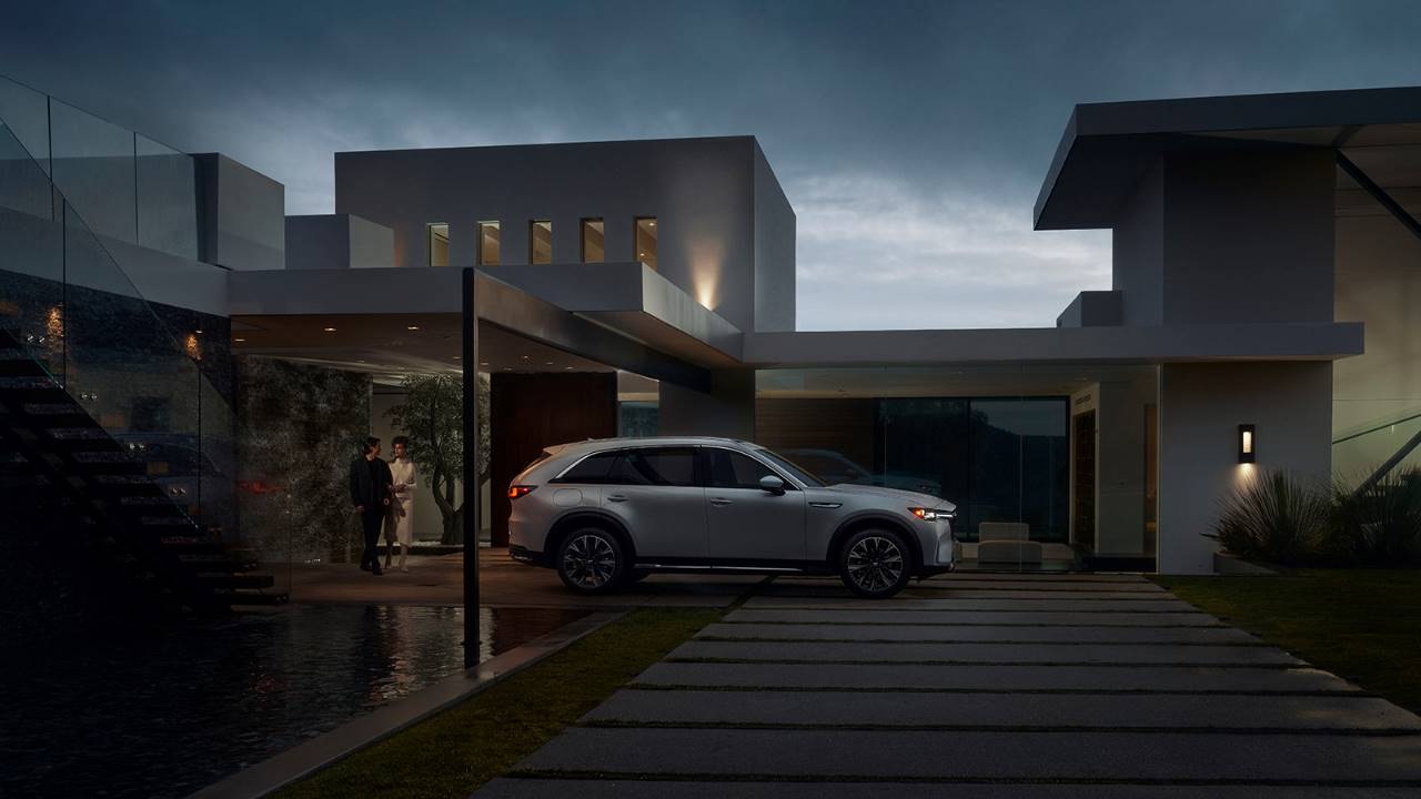 A Mazda PHEV charging at night