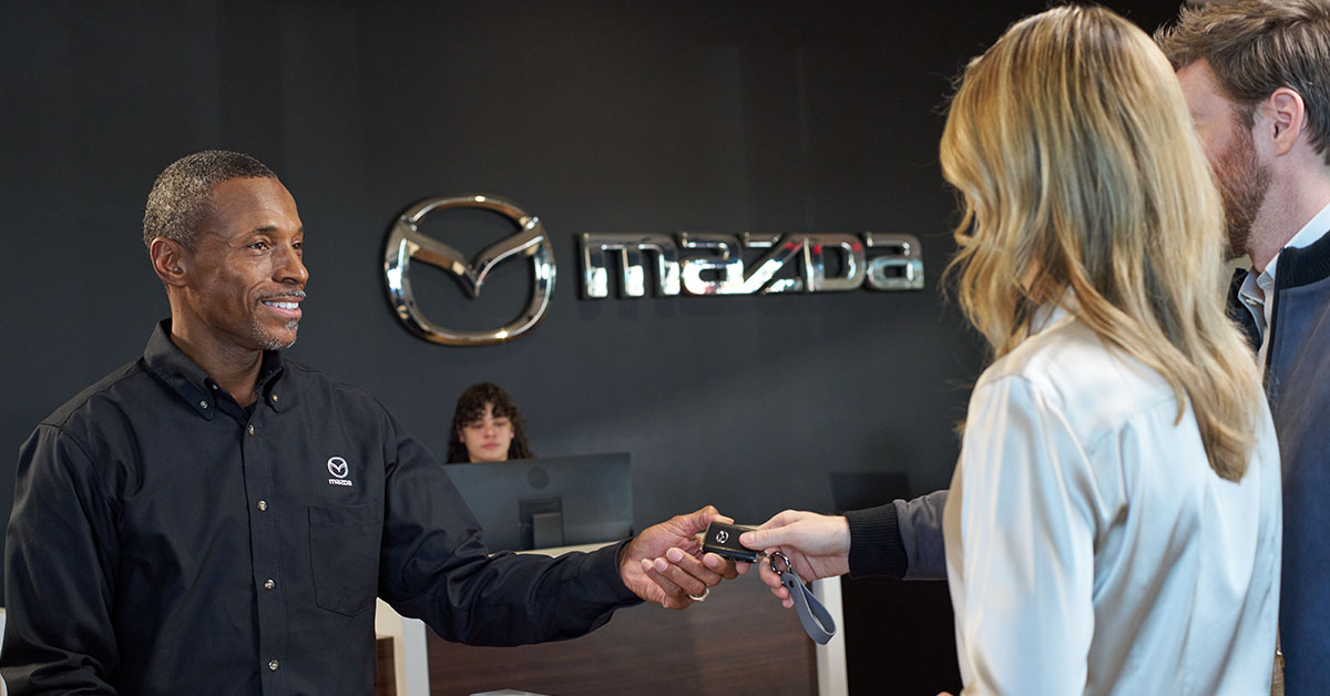 Customer speaking with a Mazda parts technician