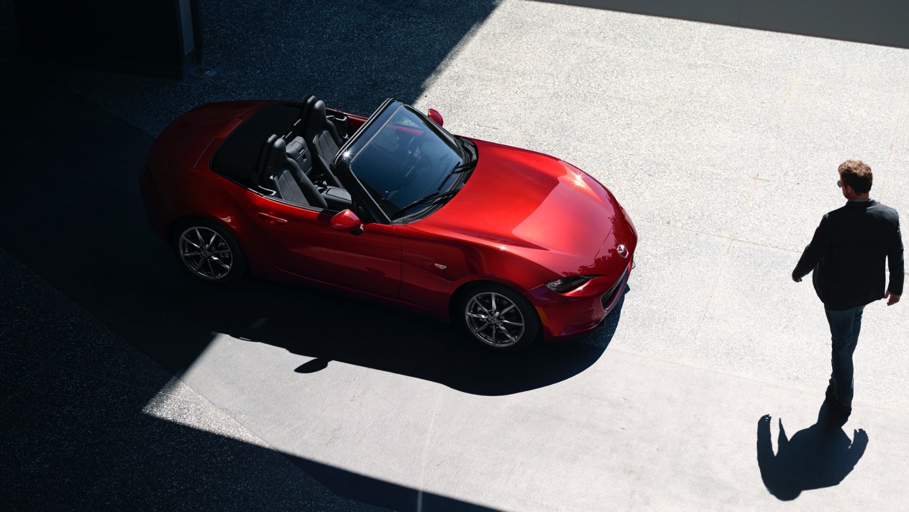 Overhead view of a red 2023 Mazda MX-5 Miata convertible.