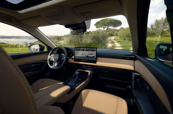 Interior of 2026 CX-5 Mazda SUV with tan leather seats and touchscreen display at Route 9 Mazda in Poughkeepsie.